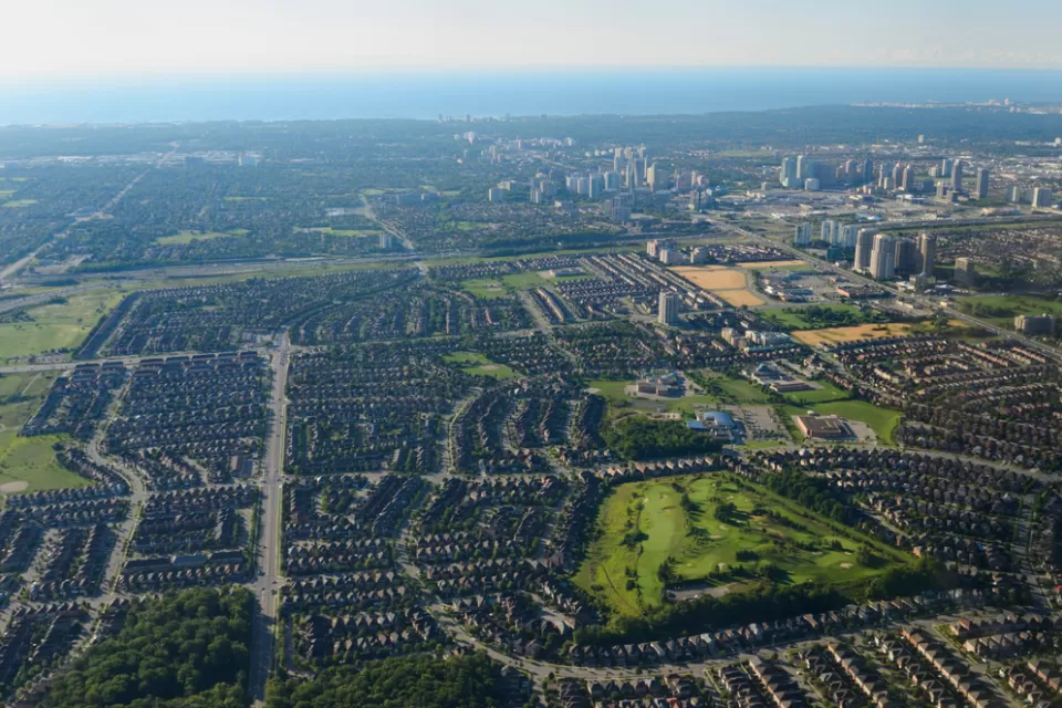 An aerial view of Mississauga, Ontario, with Lake Ontario in the background.